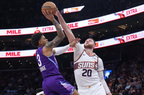 Phoenix Suns center Jusuf Nurkic (20) blocks a shot from Utah Jazz guard Keyo<em></em>nte George (3) during the second quarter of a game at the Delta Center in December.