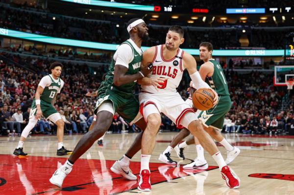 Chicago Bulls center Nikola Vucevic (9) drives to the basket against Milwaukee Bucks forward Bobby Portis (9) during a game in December.