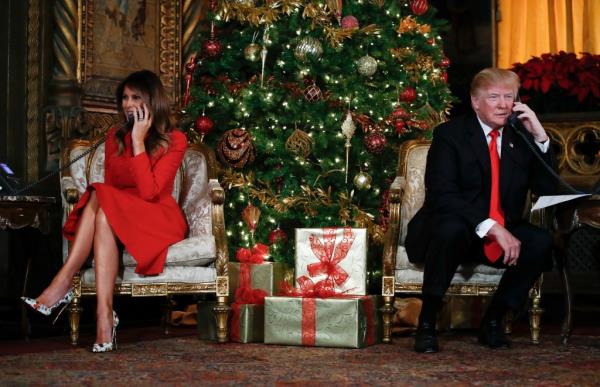 President Do<em></em>nald Trump and first lady Melania Trump speak on the phone with children as they track Santa Claus' movements with the North American Aerospace Defense Command (NORAD) Santa Tracker on Christmas Eve at the president's Mar-a-Lago estate in Palm Beach, Fla., Sunday, Dec. 24, 2017. 