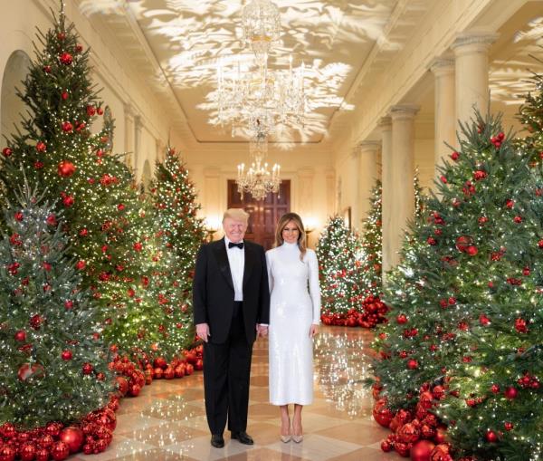 President Do<em></em>nald J. Trump and First Lady Melania Trump are seen in their Official Christmas Portrait on Saturday, December 15, 2018, in the Cross Hall of the White House. 