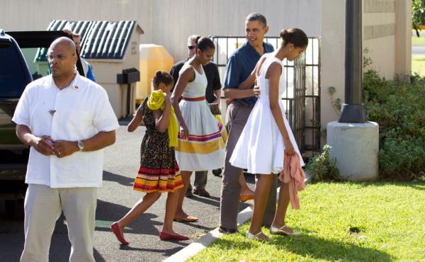 President Barack Obama, first lady Michelle Obama, and their daughters Malia and Sasha arrive for Christmas service at the Kaneohe bay Chapel on Marine Corps ba<em></em>se Hawaii, Sunday, Dec. 25, 2011, in Kaneohe, Hawaii. 