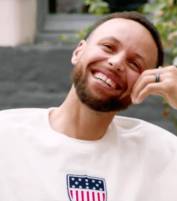 Steph Curry laughs during an ESPN interview.