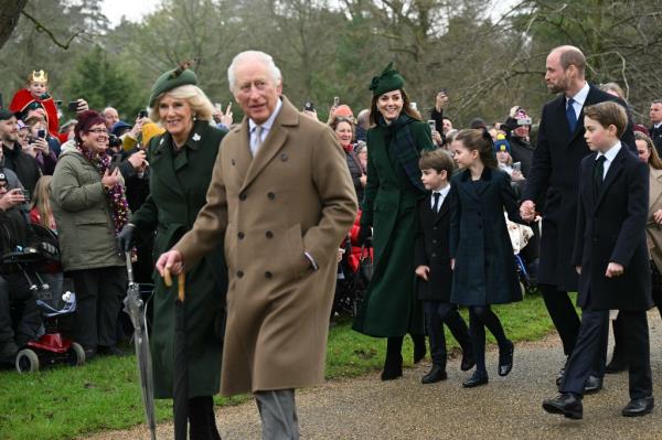 Queen Camilla and King Charles greet the public during their 2024 Christmas walk. 