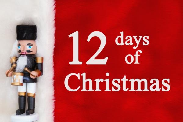 12 Days of Christmas message accompanied by a toy soldier nutcracker on a plush red and white material