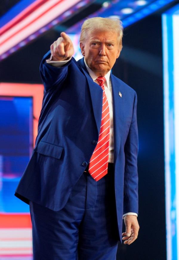 President-elect Do<em></em>nald Trump gestures at Turning Point USA's AmericaFest in Phoenix, Arizona, U.S., December 22, 2024.