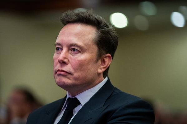 Elon Musk listening to President-elect Do<em></em>nald Trump at a House Republicans Co<em></em>nference meeting in Washington, DC, 2024