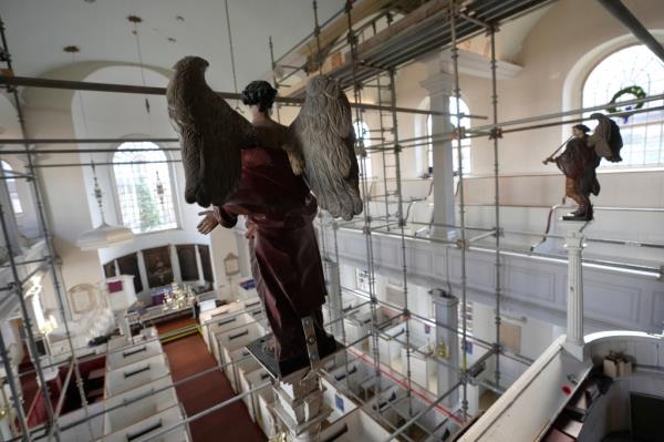 Statues of angels in elevated positions at Old North Church, Boston, captured on Dec. 18, 2024.