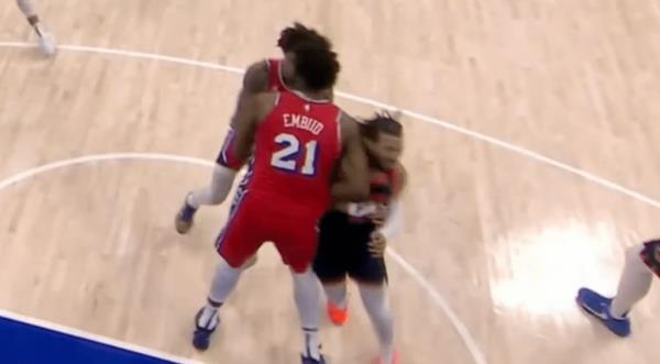 Joel Embiid (L.) elbows Jalen Brunson during Game 5 of the first-round playoff series between the Knicks and 76ers on April 30, 2024. 