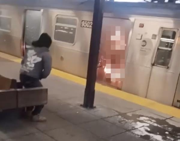 Video obtained by the Post shows an unidentified suspect, left, speaking to police after watching as a woman burned to death on a subway train car in Co<em></em>ney Island early Sunda