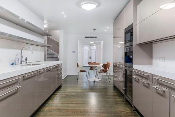 The chef's kitchen, formerly Warhol's studio, still boasts green splattered paint on the floor 