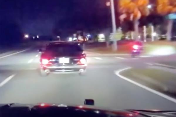 Santa Claus in Florida Highway Patrol uniform riding a motorcycle