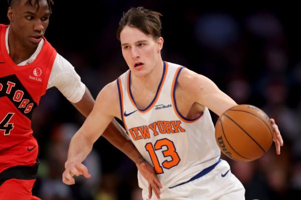 Knicks guard Tyler Kolek (13) controls the ball against Toro<em></em>nto Raptors guard Ja'Kobe Walter (14) during the fourth quarter at Madison Square Garden.