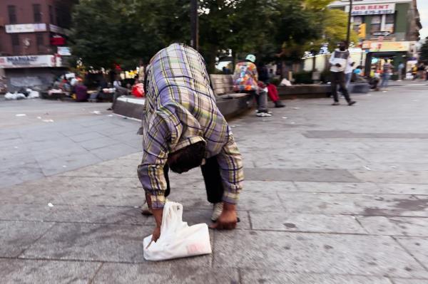 A drug user hunched over in The Hub's Roberto Clemente Plaza on Nov. 13, 2024.