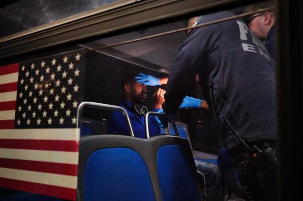 A man injecting a woman with drugs in broad daylight on a sidewalk in "The Hub" in the Bronx on Nov. 27, 2024.