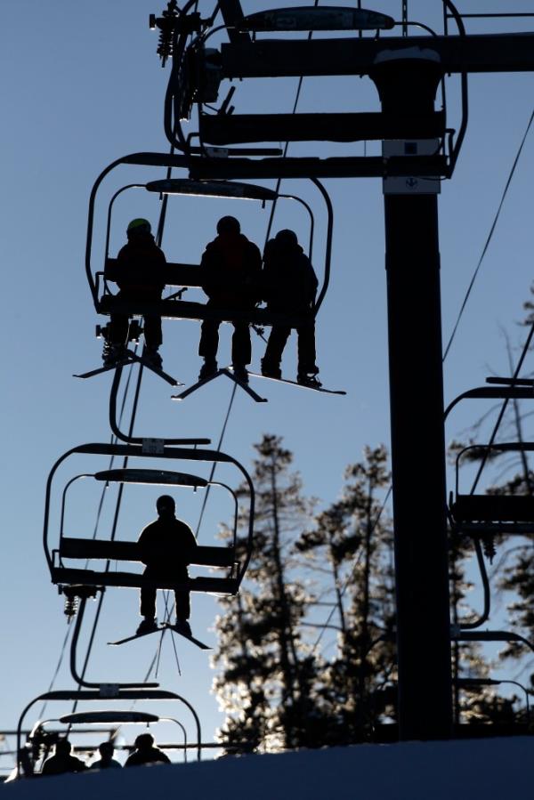 Skiers and snowboarders riding a lift at Winter Park Resort in Colorado, December 20, 2012.