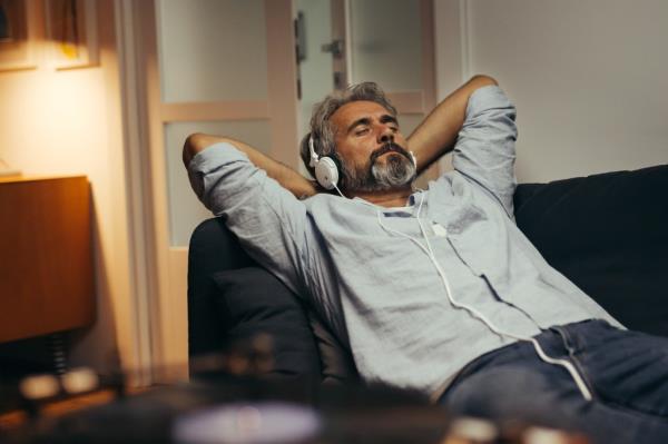 A man relaxing while listening to music