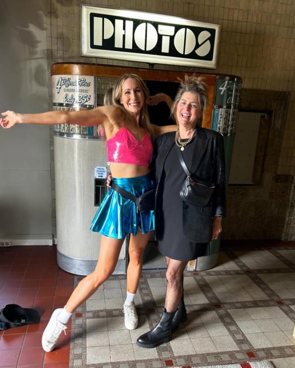 Nikki Glaser posing with another woman at Taylor Swift Concert