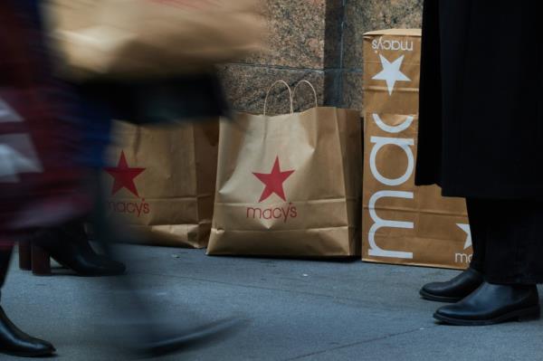 Shopping bags in front of Macy's flagship store in Herald Square, New York, indicating slower US holiday sales growth