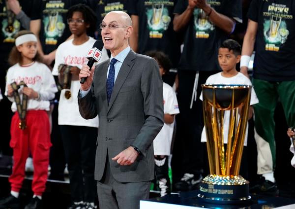 NBA commissio<em></em>ner Adam Silver presents the trophy to the Milwaukee Bucks after they won the Emirates NBA Cup champio<em></em>nship game against the Oklahoma City Thunder at T-Mobile Arena. 