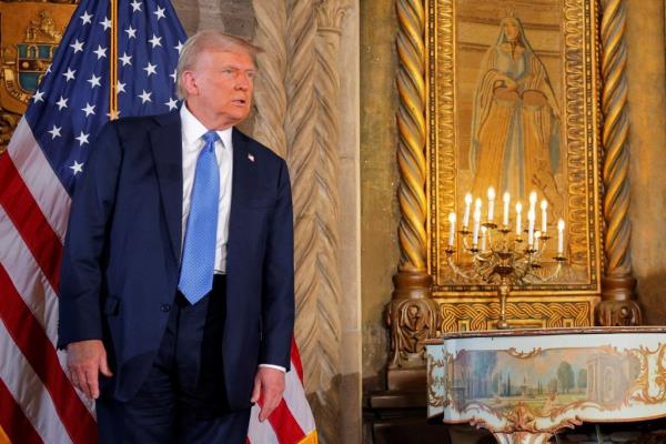 President-elect Do<em></em>nald Trump listens to a question from a reporter after delivering remarks at Mar-a-Lago in Palm Beach, Florida, U.S., December 16, 2024.