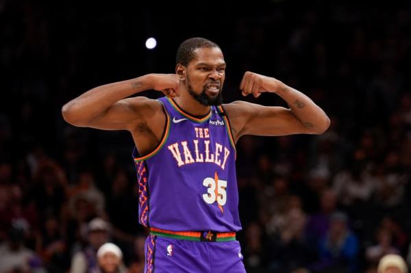 Phoenix Suns forward Kevin Durant (35) celebrates a play during the second half of an NBA basketball game against the Portland Trail Blazers, Sunday, Dec. 15, 2024, in Phoenix. 