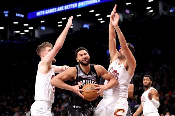 Ben Simmons gets trapped by two Cavaliers defenders during the Nets' loss on Dec. 16.