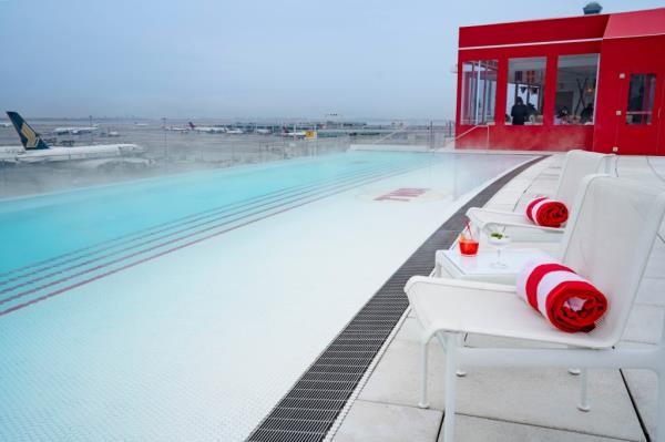 TWA Hotel's seaso<em></em>nally decorated heated rooftop pool with fantastic runway views