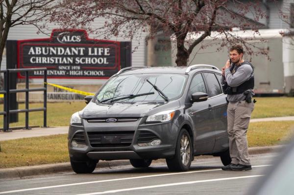 Law enforcement officers arrive at the scene.