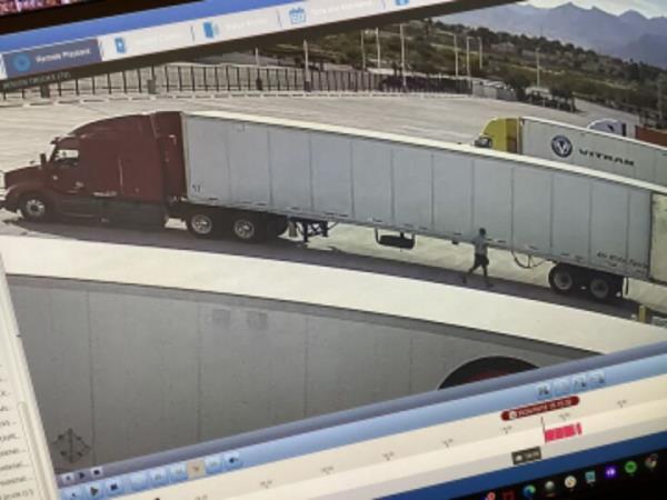 Surveillance footage of stolen holiday goods in trucks destined for an Amazon warehouse related to Toy biz scam