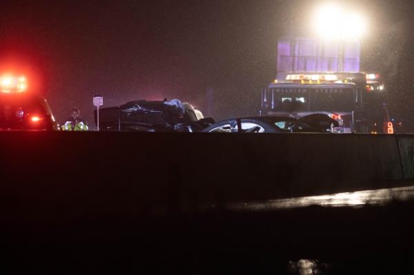 car crash scene on hutchinson river parkway in rain in night time