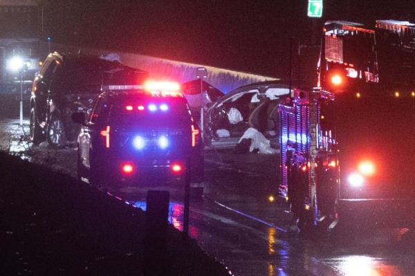 police and fire department vehicles crowded around crash site